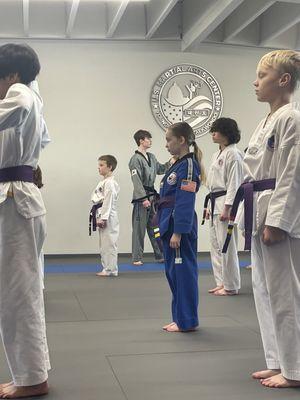 Our girl getting ready to get her next belt.