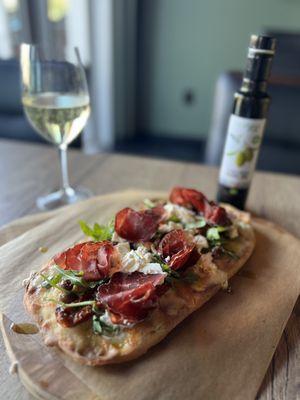 Bresaola, sun dried tomatoes, arugula, & cheese with the most buttery, amazing olive oil I've ever tasted!