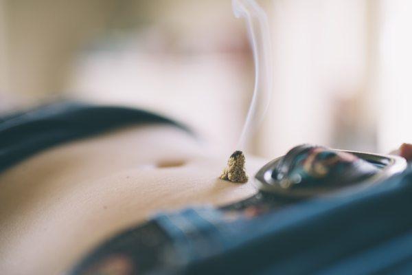 Moxibustion is a traditional therapy for easing pain and supplementing weak areas.