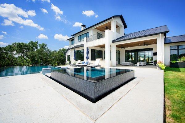 Black glass makes the perfect reflective surface. This space seems to be the crown jewel of this beautiful home.