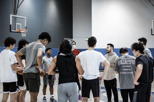 Tony Vasaturo breaking down with one of his high school groups