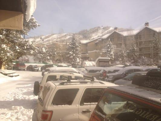 Parking area at the hotel entrance, with view up to the ski area.