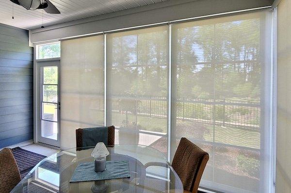 Enjoy the outdoor views with a beautiful screened-in porch!