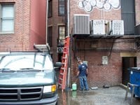 Newbury st Boston. We change an air conditioner on side of building.