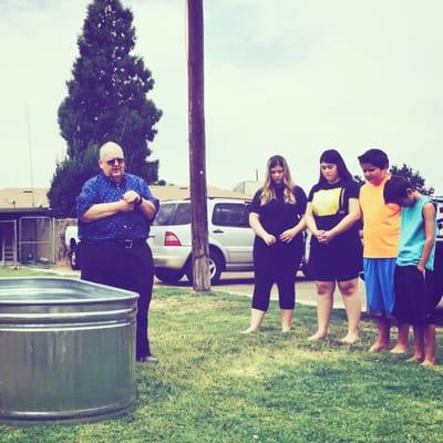 Four young people about to be baptized by Pastor: Richard Ogle