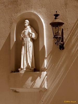 Sculpture of Saint Francis on the wall.