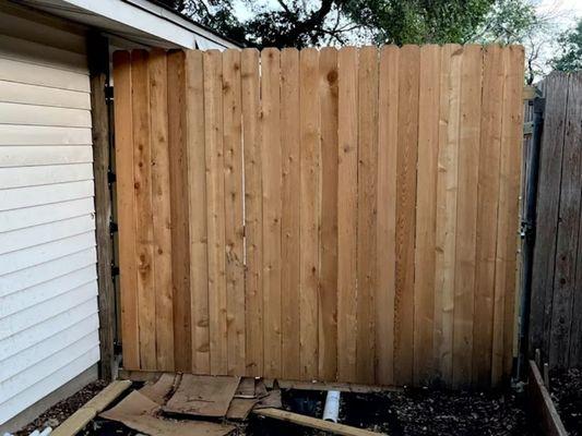 8v high and 10' wide swing gate, hinged to the side of fhe home.