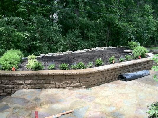 Stone patio/walkway with retaining wall