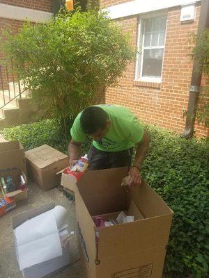 Packing boxes for disposal.