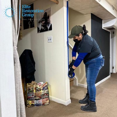 a photo of the team who do a restoration services on flooded basement