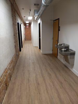 Hallway with water fountains with men's and women's bathrooms