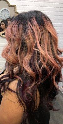 Rose gold hair coloring with style.