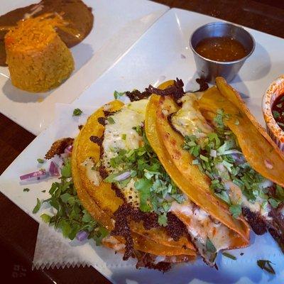 Birria Tacos with a side of rice and beans