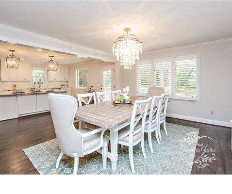 Transitional dining room, upholstered captains chairs, shell chandelier, transitional rug, 1970's remodel, home styling and home staging