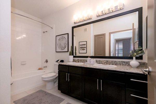 Double vanities, framed mirrors and soaking tubs in baths