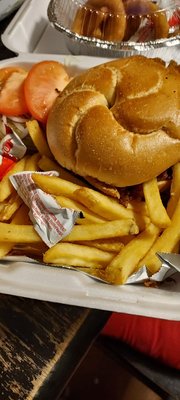 Bacon cheese Burger with mushrooms, french fries and an order of onion rings with a 2-liter Pepsi.