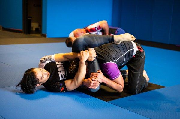 Midwest Martial Arts Academy students during live grappling (rolling).