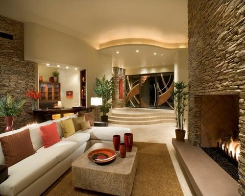 Inside the Great Room, a stacked stone fireplace brings the outside finishes in, and the open floorplan encourages entertaining.