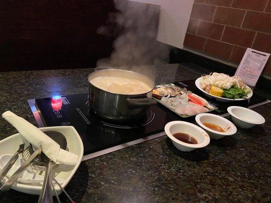 Seafood with spicy broth and udon noodles