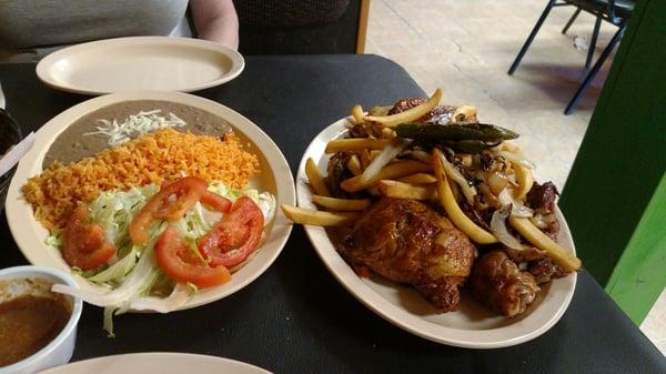 Smoked chicken with onions, peppers and fries, rice and beans