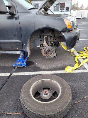 This customers 2007 nissan front right axle feel of the side of the highway.