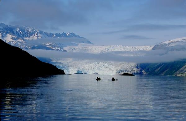 Kayakers approach Aialik Glacier.