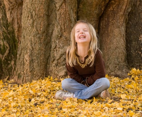 Portrait of laughter among the leaves