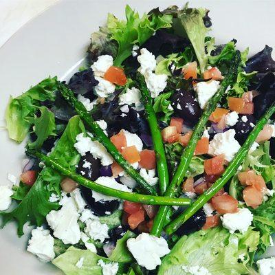 Market fresh salad with heritage blend base, feta, grilled asparagus, kalamata olives, tomatoes, and vinaigrette.