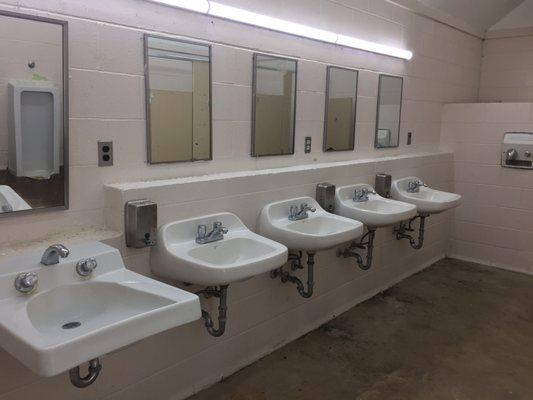 Dated but partially functional toilets and sinks