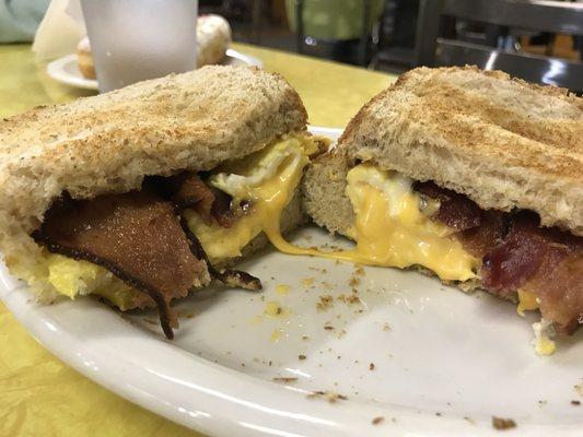 Bacon, egg and cheese sandwich with homemade wheat bread