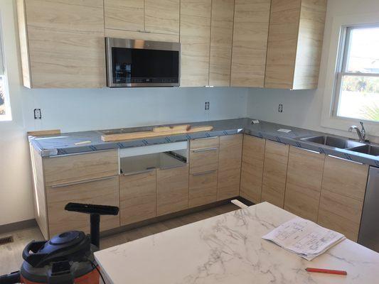 Kitchen cabinets stainless steel countertops and marble island