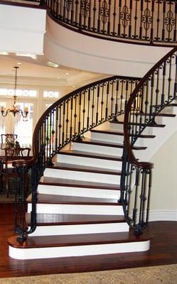 Custom Walnut stair case with iron balusters