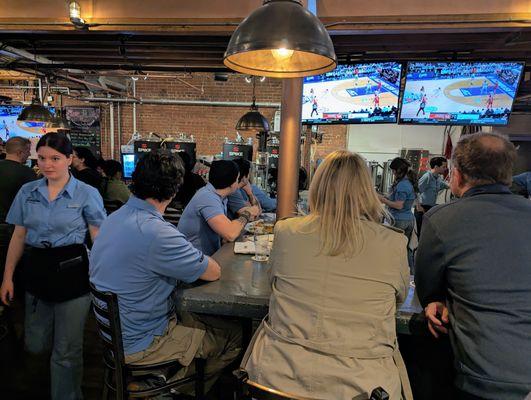 Inside. Lower level at the bar, watching North Carolina vs NC State in the 2024 ACC Tournament championship game on March 16, 2024.