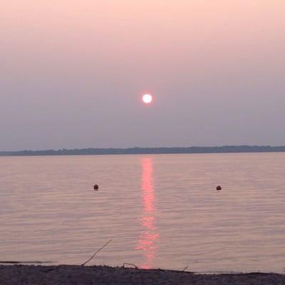 Sunset over Lake Petenwell from the beach.