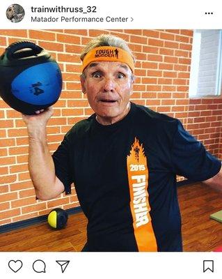 Tough Mudder finisher and friend Thomas showing off his gear.