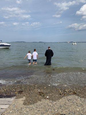 Open ocean baptism with Father Gray