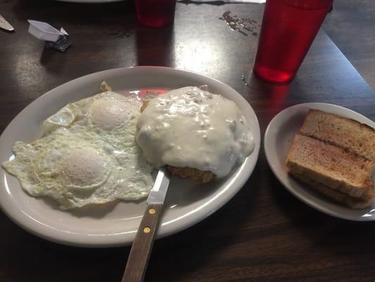 2 eggs with country fried steak and wheat toast