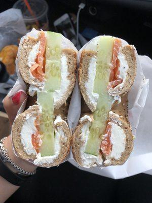 Whole wheat everything scooped out with lox, cream cheese & cucumber