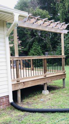 Seamless gutters and power washed deck