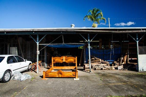 Custom mango wood bed basking in the rare Hilo sunshine