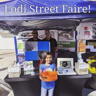 Eddie on the left, Lonnie on the right, Owners. W/ Eddie's daughter helping answer questions at the Lodi Street Faire!