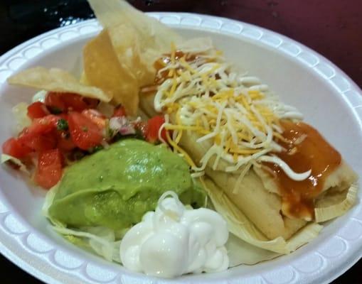 Chicken Tamale w/ pico de gallo, guacamole, sour cream, & hot salsa.