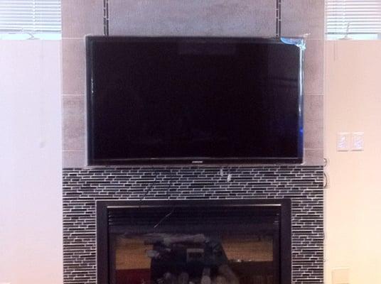 TV Installed above Fireplace