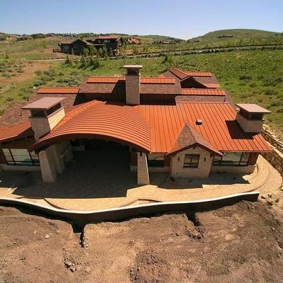 We installed Ice and water underlayment. Then Installed a Corten Metal skirt. We used Corten Metal To form curved roof panels...