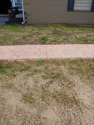 The topsoil was not applied properly up to the sidewalk