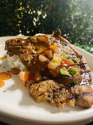 Pork chop al pastor over bed of lime biscotti rice