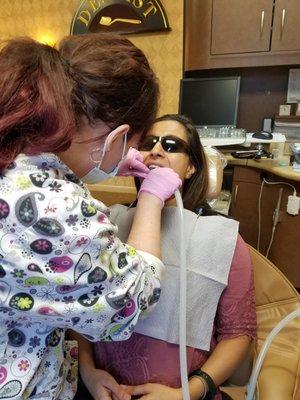 Dr. Abernethy working on a patient