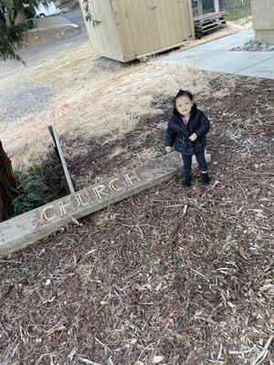 Just a cool sign that was in the back and wanted a picture of my daughter by