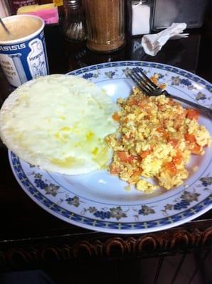 Huevos Perico w/an arepa con queso. (Google it if you need it tranlated. The word "delicious" will be in there somewhere.