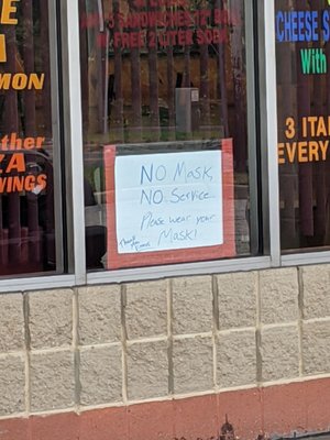 Handmade sign say where your masks but open the door and you see the employees' nose out in the open.